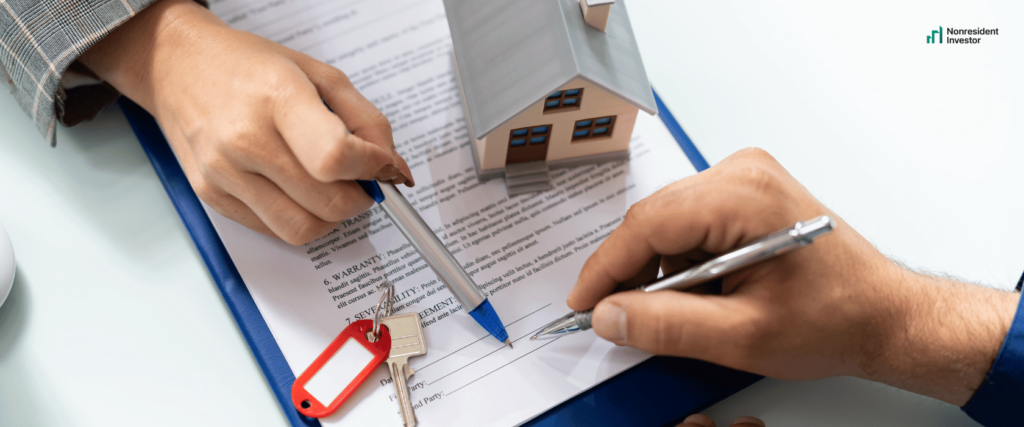 a nonresident investor is signing a home ownership contract for his first us real estate investment